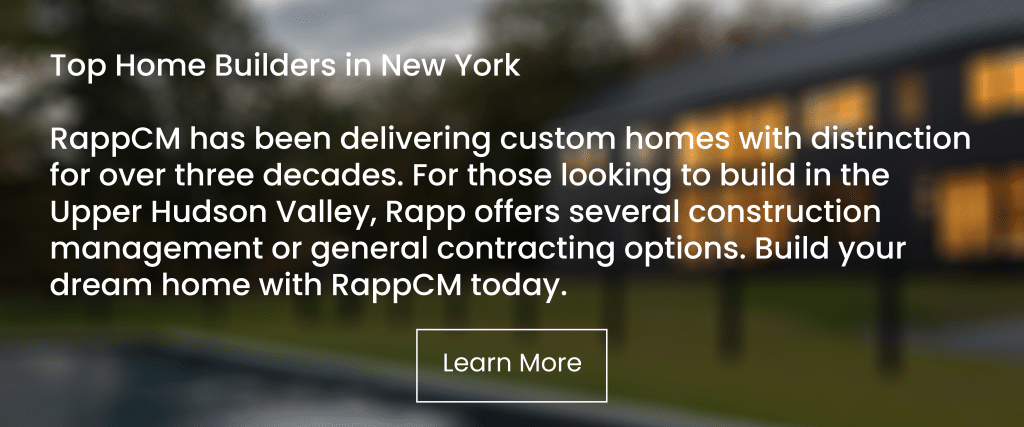 Text set on blurred background. "Top Home Builders in New York. RappCM has been delivering custom homes with distinction for over three decades. For those looking to build in the Upper Hudson Valley, Rapp offers several construction management or general contracting options. Build your dream home with RappCM today. Learn More"